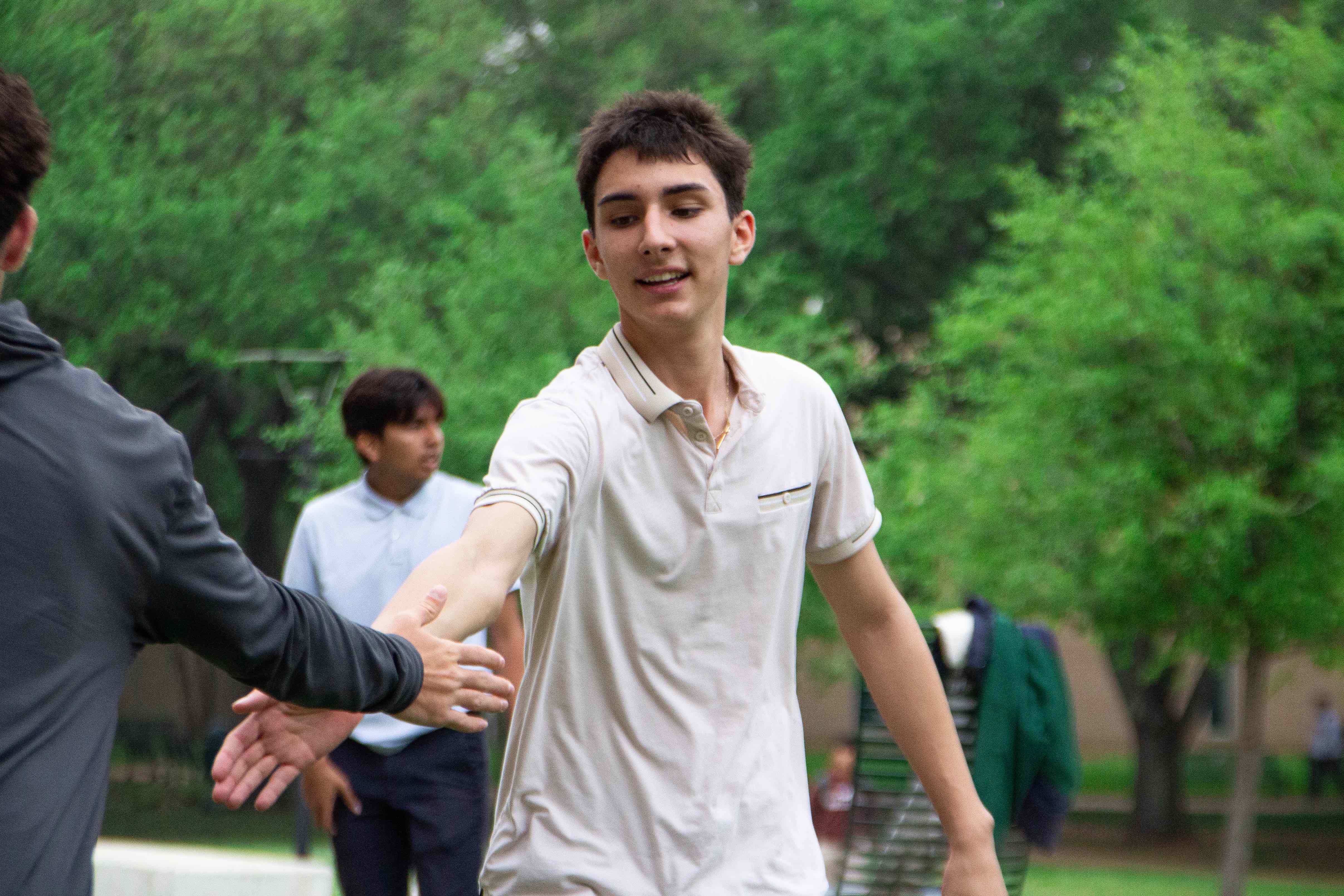 Students greeting each other during a game